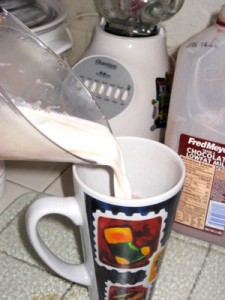 Pouring in 1/4 cup of Hazelnut Creamer